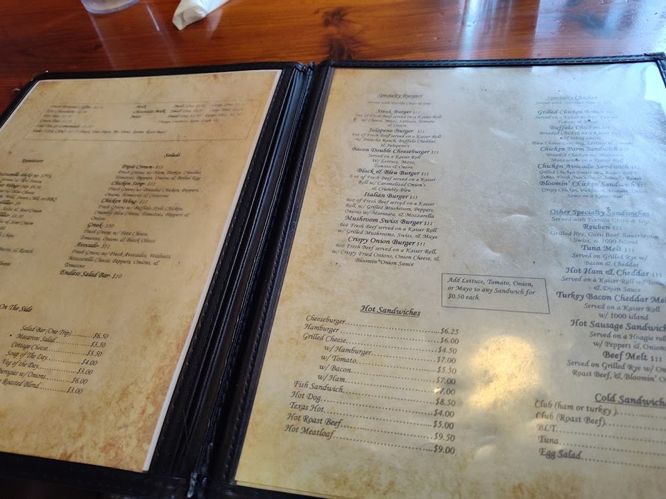 Menu board with classic diner dishes and sides.